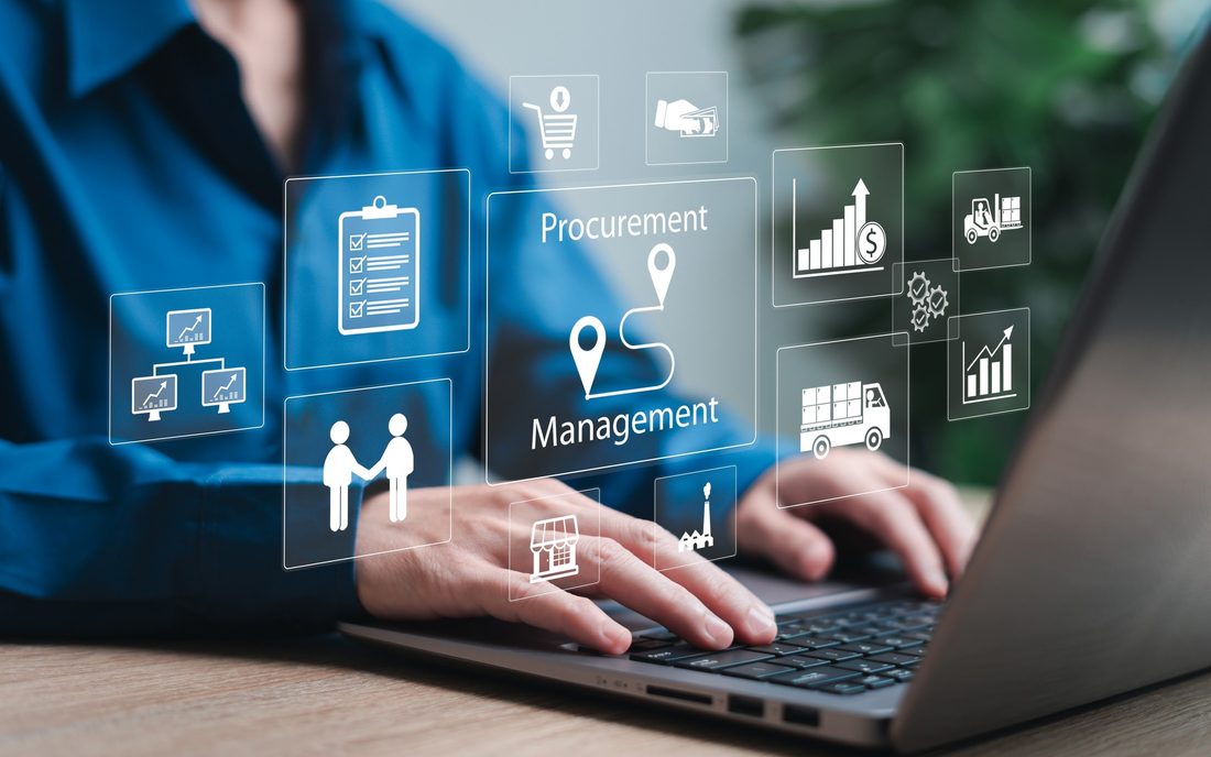 A procurement manager working on a laptop with supply chain icons overlaid